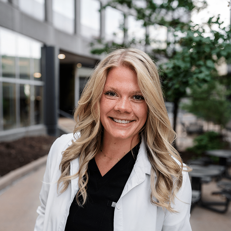 Dr. Schmidt white coat edited_square Dr. Janie Boyesen headshot